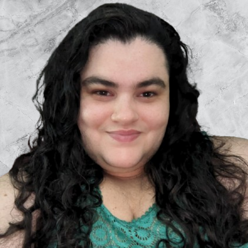 Angela smiling looking at the camera